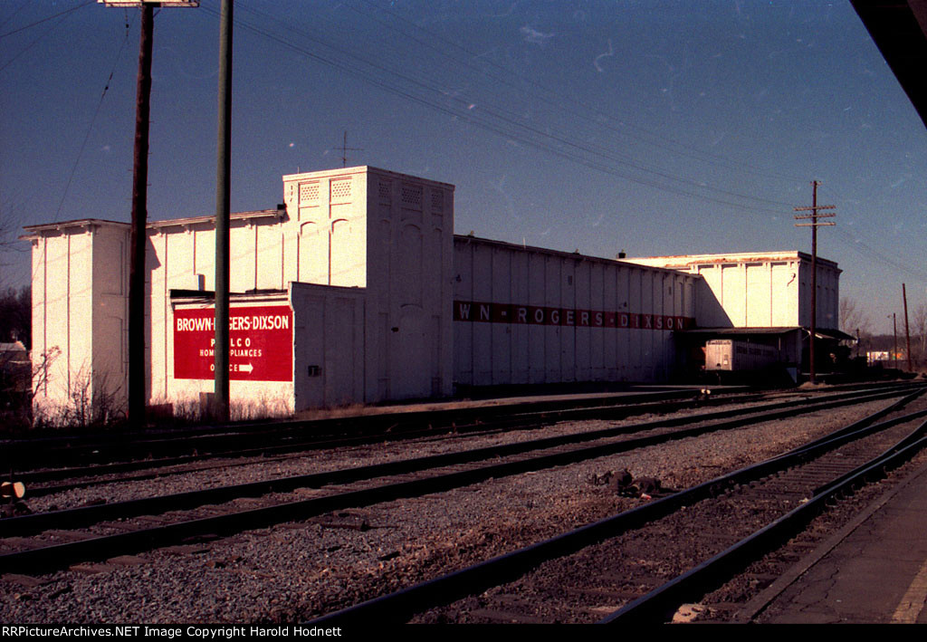 Brown Roger Dixon appliance warehouse across tracks from Seaboard Station